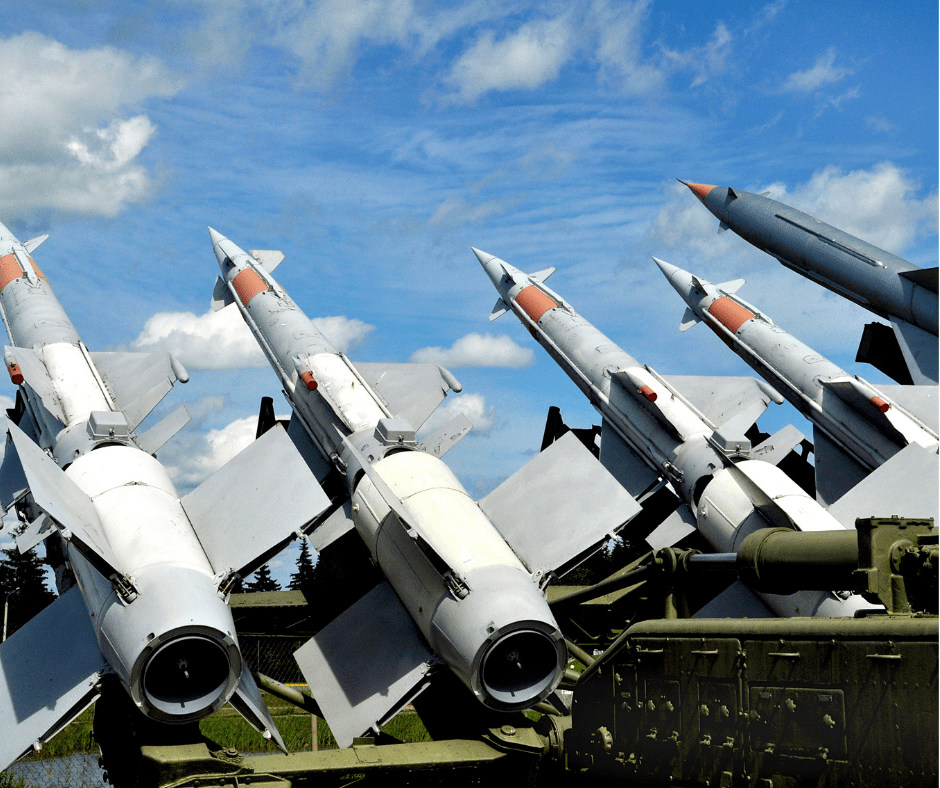 military missiles positioned next to each other aiming into the skies