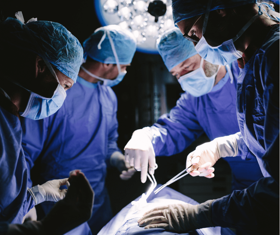 composites being used as precision surgical instrument during surgery by doctors surrounding the table 