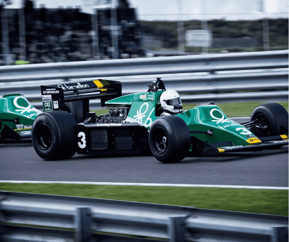 green f1 race car on the racing track